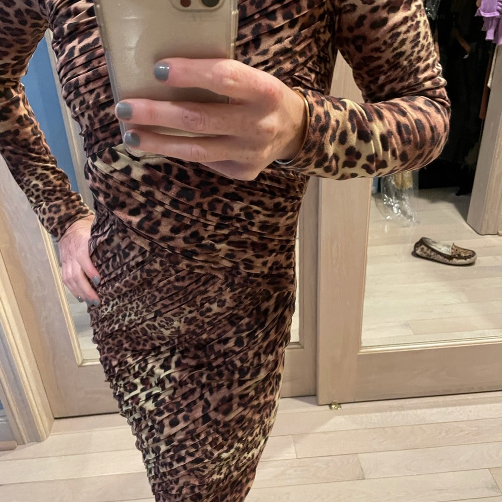 Meow! Sexy and flattering animal print dress.